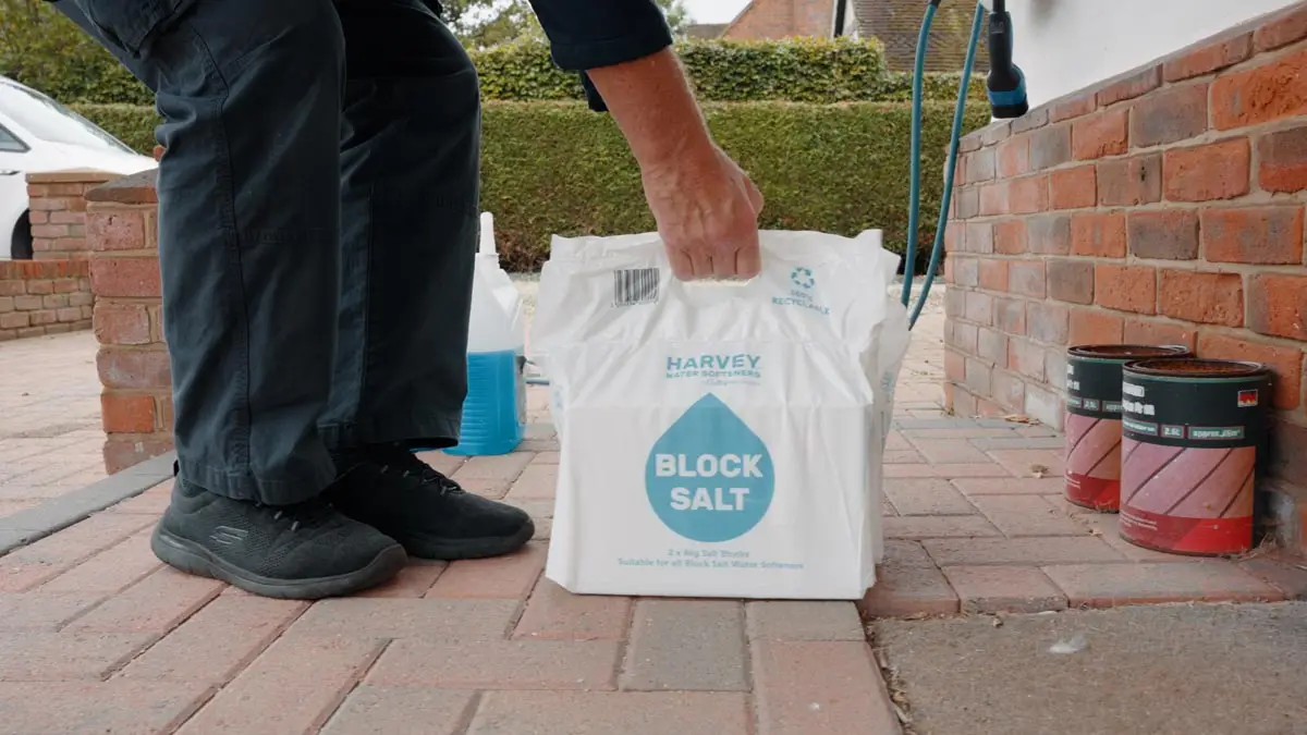 Southern Softflow engineer delivering Harvey block salt to a customer doorstep