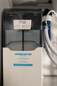 Infinity water softener installed under a kitchen sink by Southern Softflow