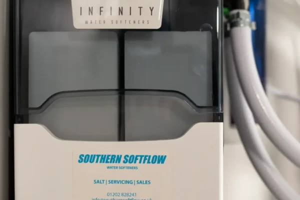 Infinity water softener installed under a kitchen sink by Southern Softflow